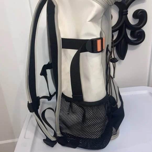 Rains Cream and Black Backpack Roll-Top Design